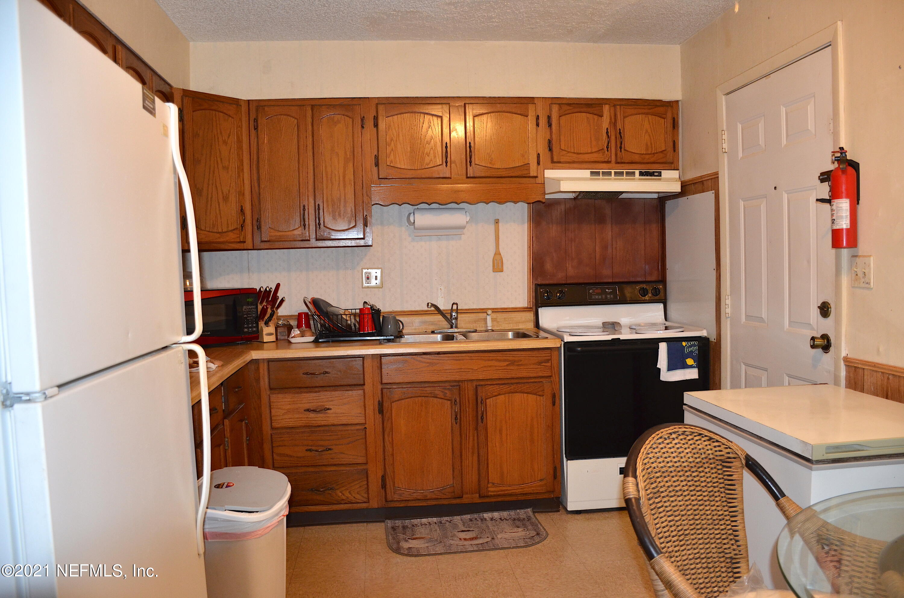 681 Rainer Road, Unit 3 Baldwin, FL 32234 - Photo 17 of 28 a kitchen with a sink cabinets and appliances