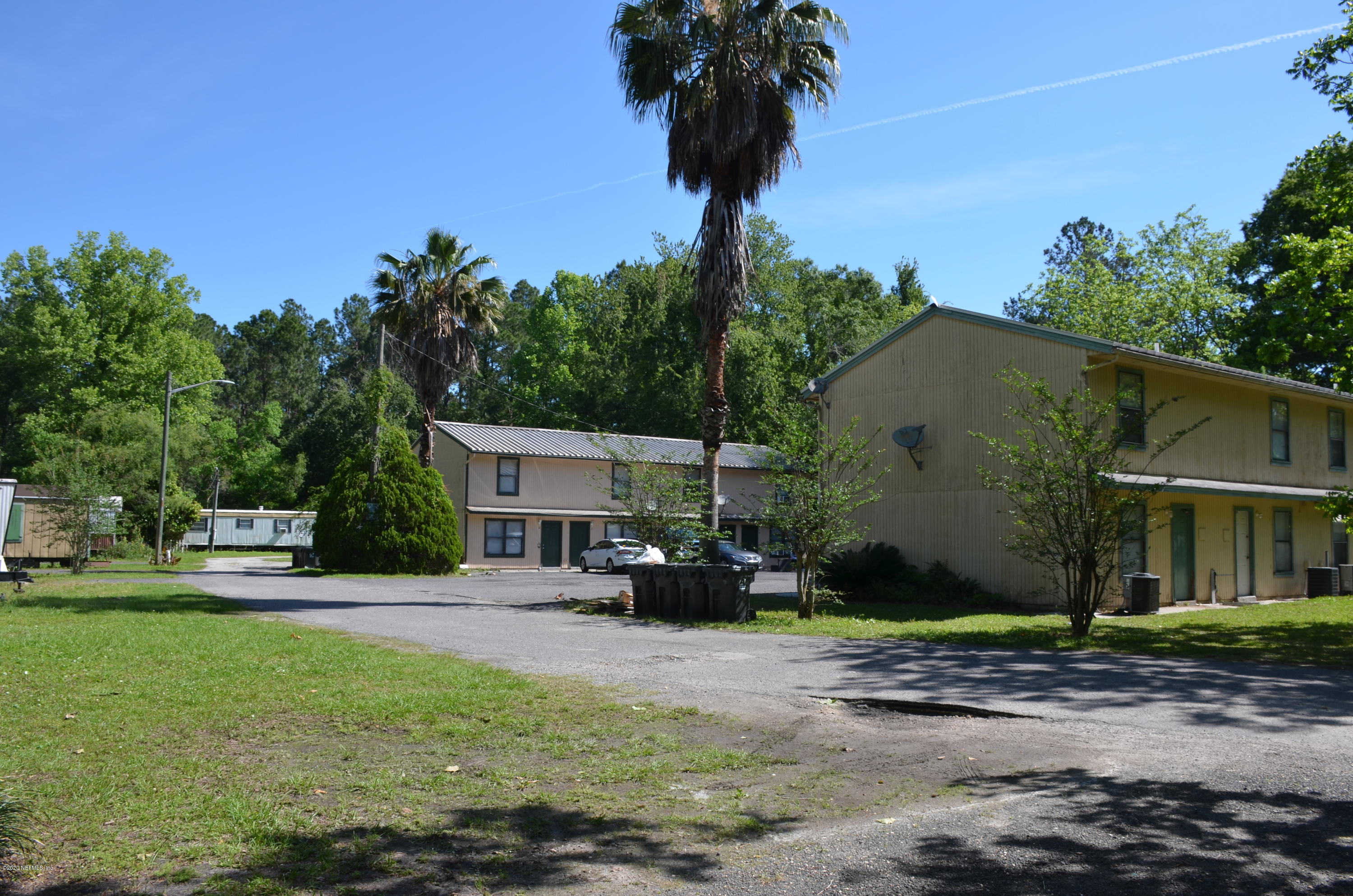 681 Rainer Road, Unit 3 Baldwin, FL 32234 - Photo 2 of 28 a view of a house with backyard and sitting area