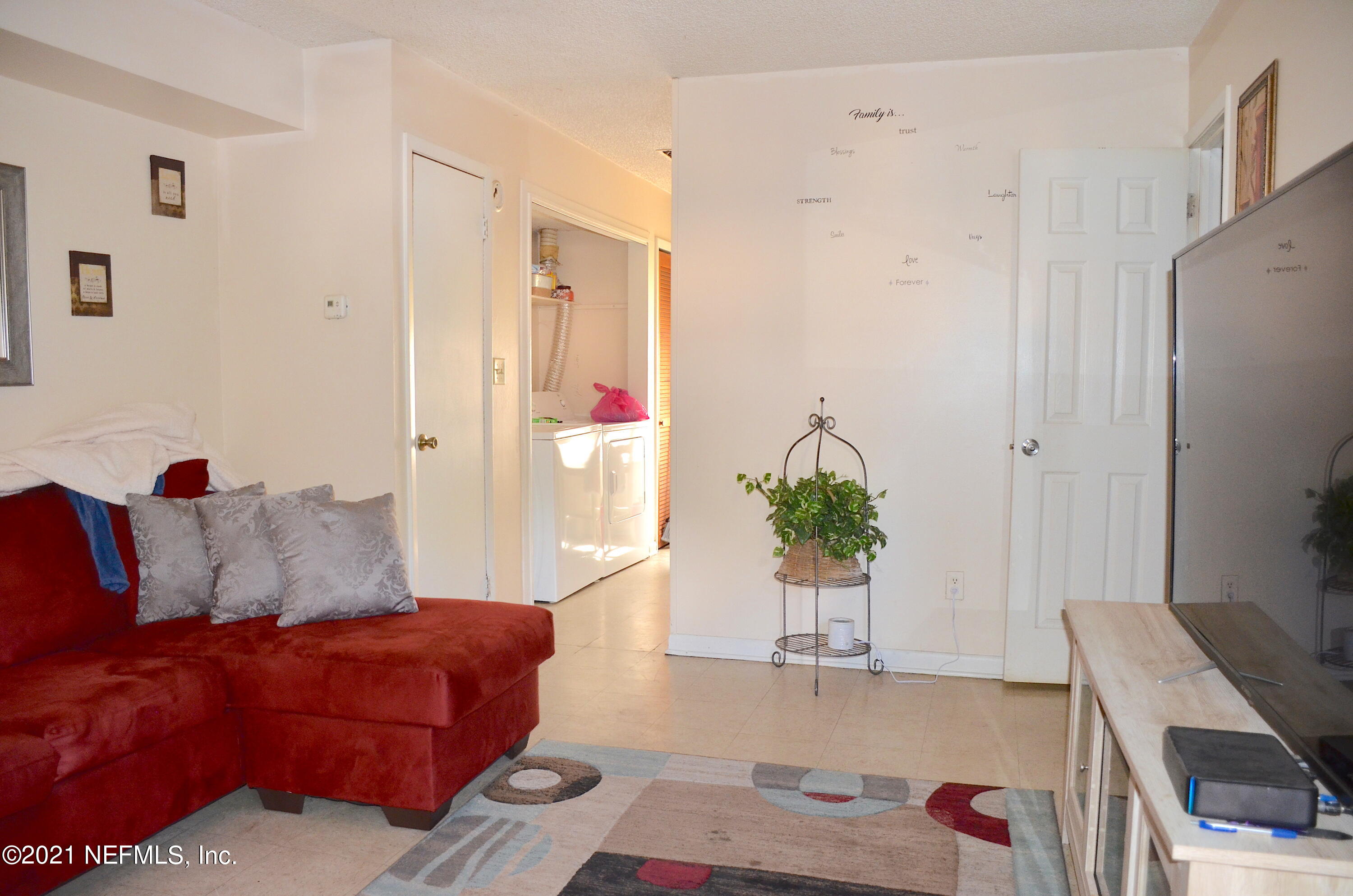 681 Rainer Road, Unit 3 Baldwin, FL 32234 - Photo 22 of 28 a living room with furniture and wooden floor