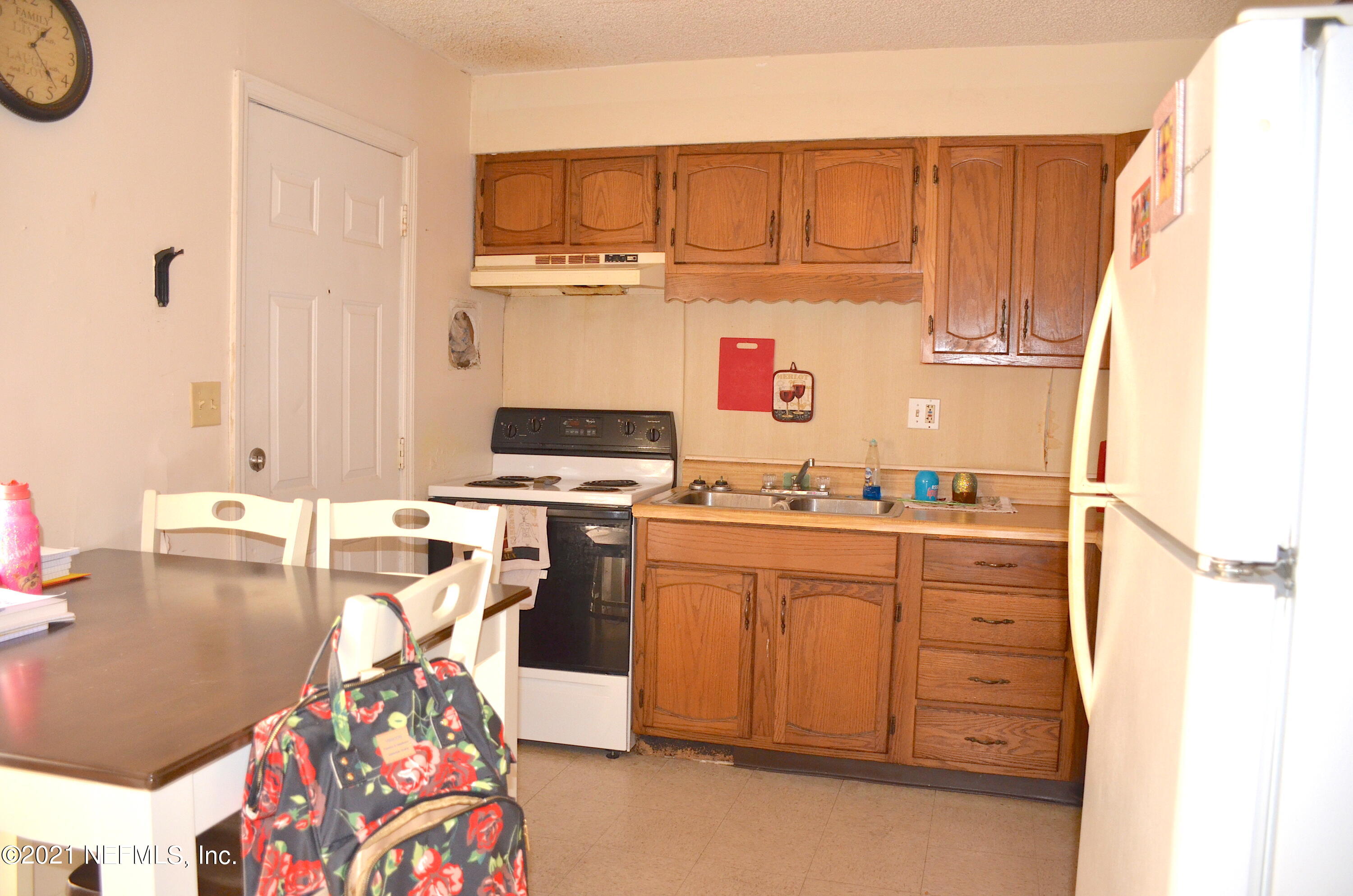 681 Rainer Road, Unit 3 Baldwin, FL 32234 - Photo 24 of 28 a kitchen with a sink and a stove top oven