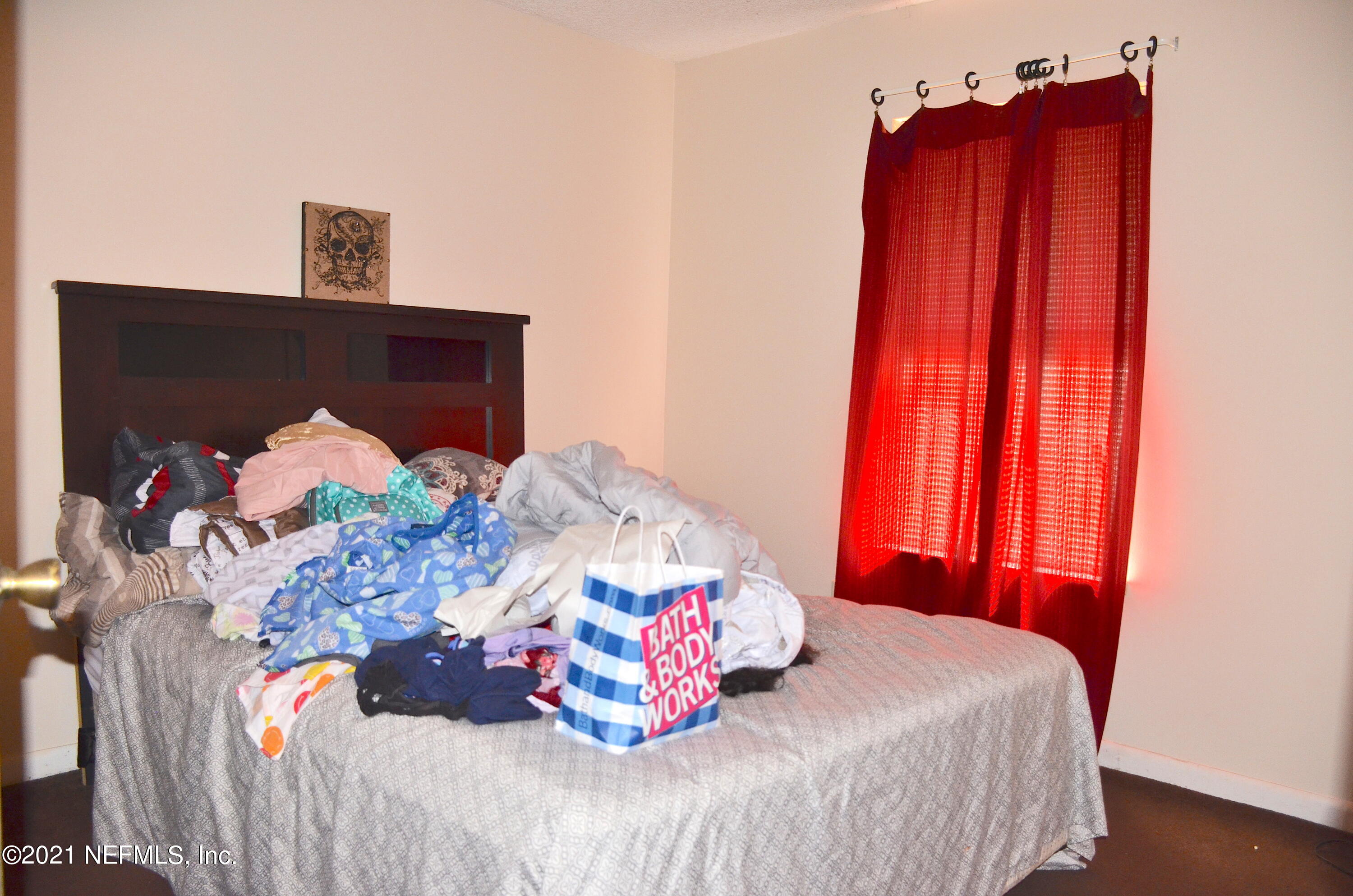 681 Rainer Road, Unit 3 Baldwin, FL 32234 - Photo 25 of 28 a bedroom with a bed and a dresser