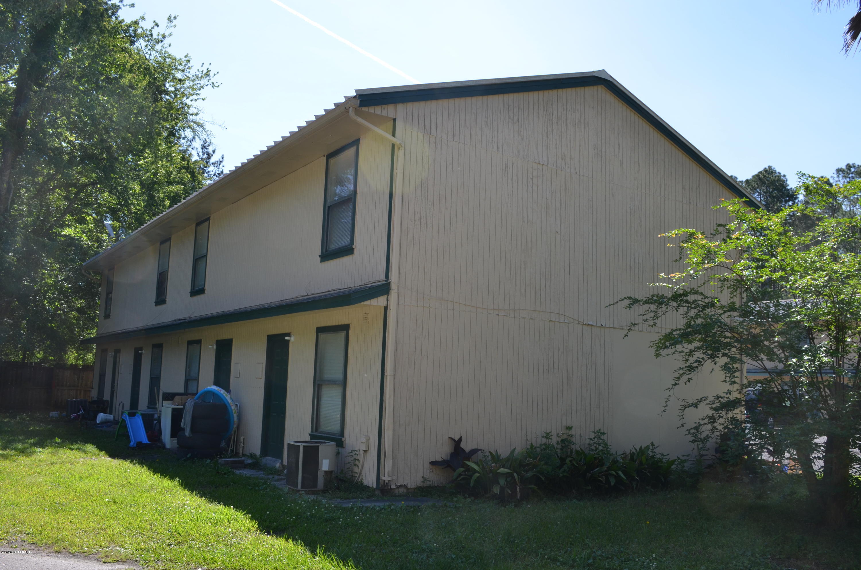 681 Rainer Road, Unit 3 Baldwin, FL 32234 - Photo 10 of 28 a view of a house with patio and garden