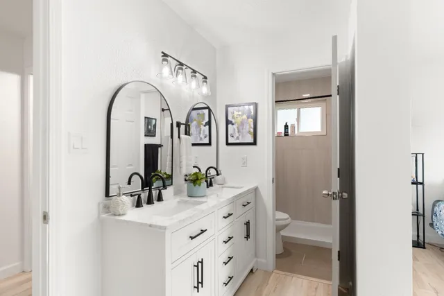 a view of a closet and a mirror