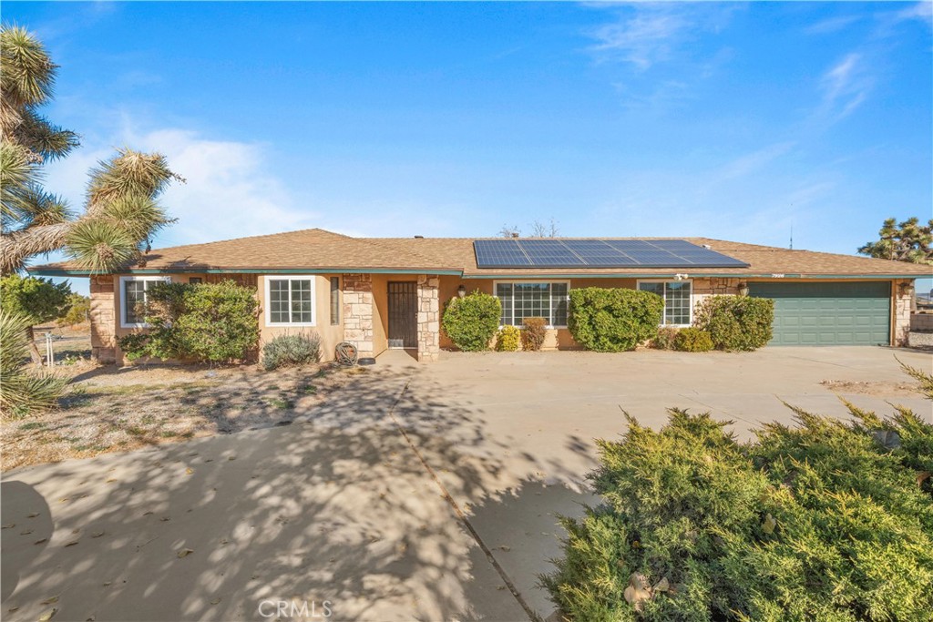 7926 Mesa Road Phelan, CA 92371 - Photo 1 of 1 a front view of a house with a yard