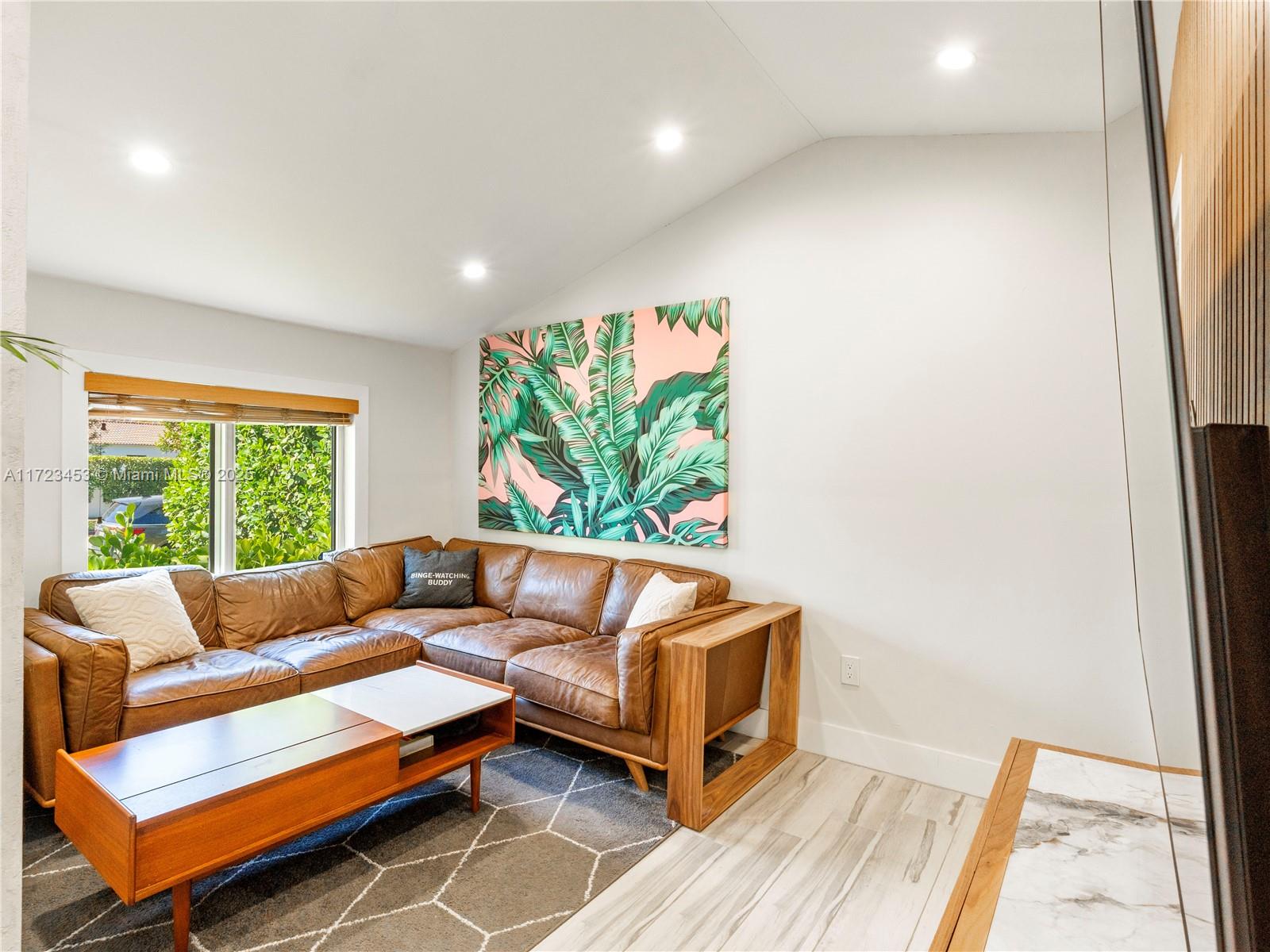 1001 Southwest 23rd Road Miami, FL 33129 - Photo 11 of 38 a living room with furniture and a large window