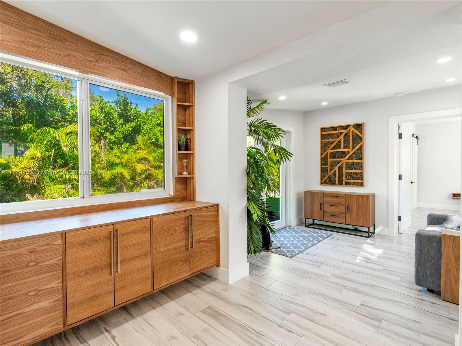 1001 Southwest 23rd Road Miami, FL 33129 - Photo 12 of 38 a living room with wooden floor and furniture