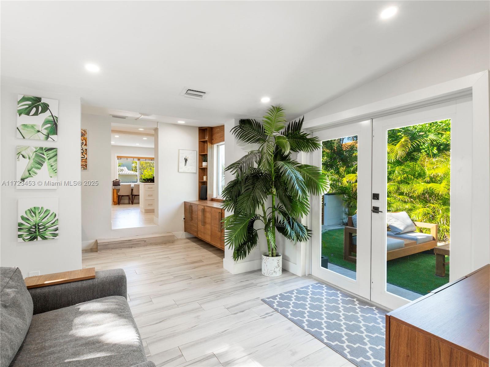 1001 Southwest 23rd Road Miami, FL 33129 - Photo 13 of 38 a living room with furniture and a potted plant