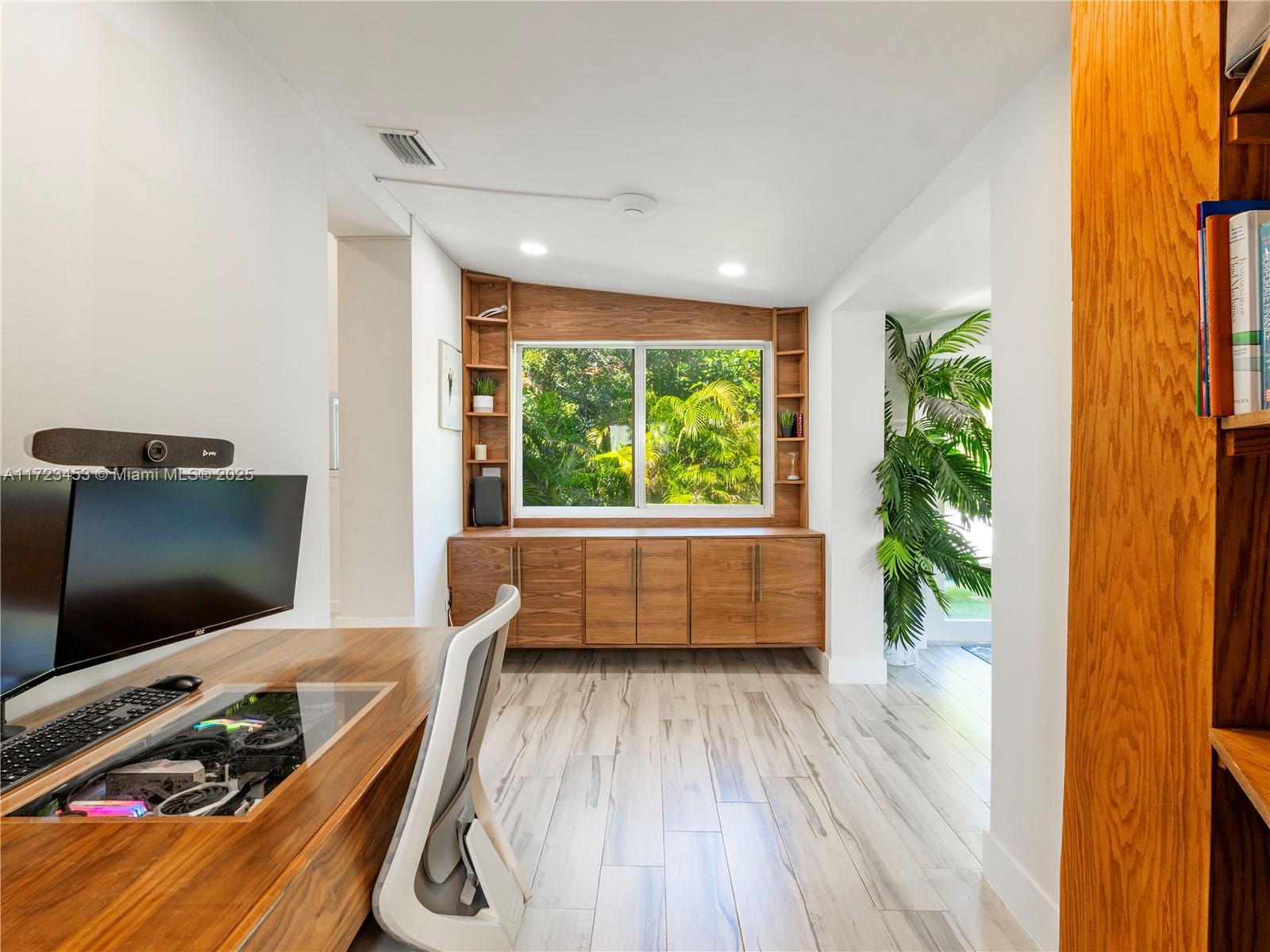 1001 Southwest 23rd Road Miami, FL 33129 - Photo 14 of 38 a room with furniture and a flat screen tv