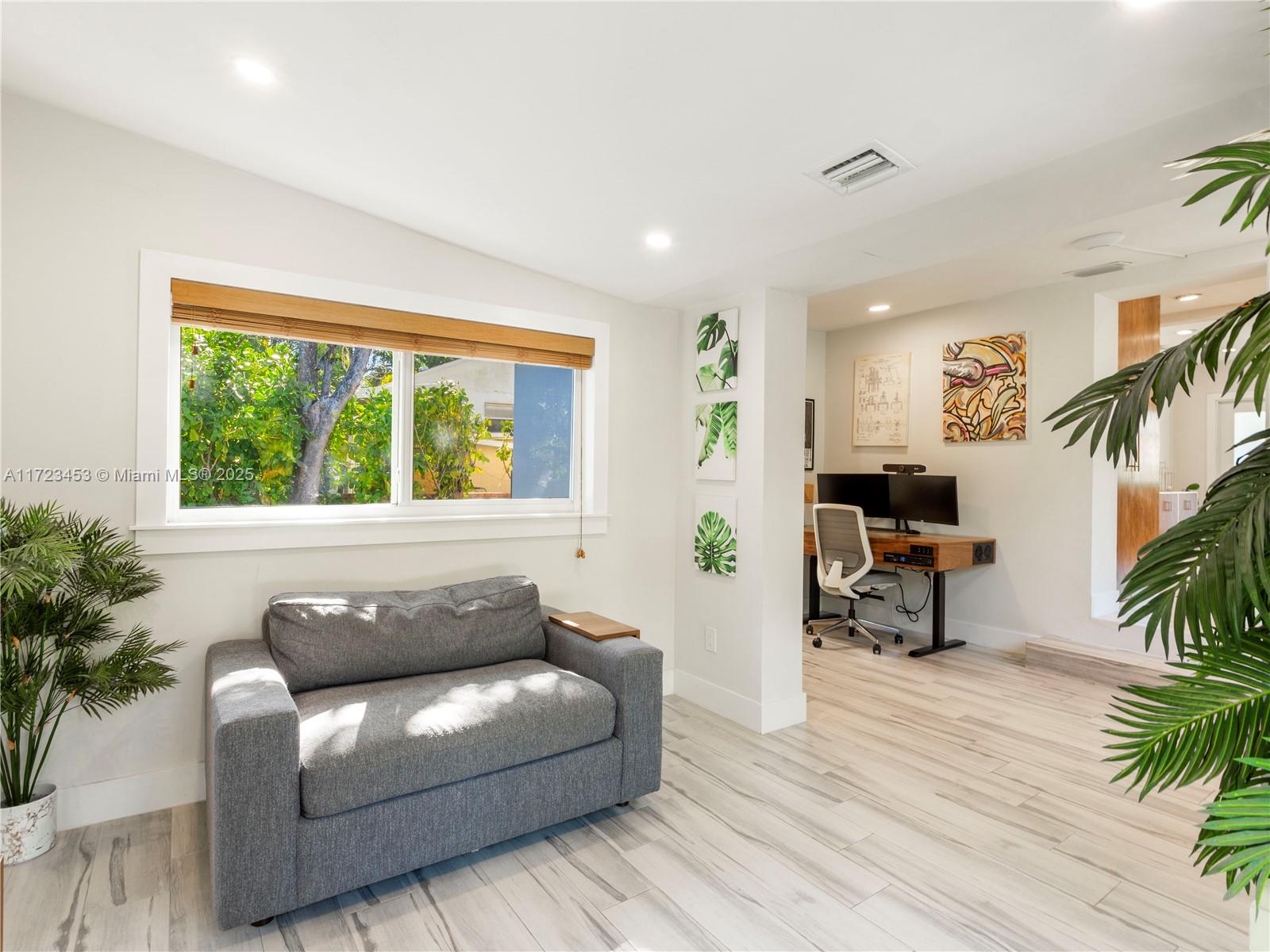 1001 Southwest 23rd Road Miami, FL 33129 - Photo 15 of 38 a living room with furniture and a potted plant