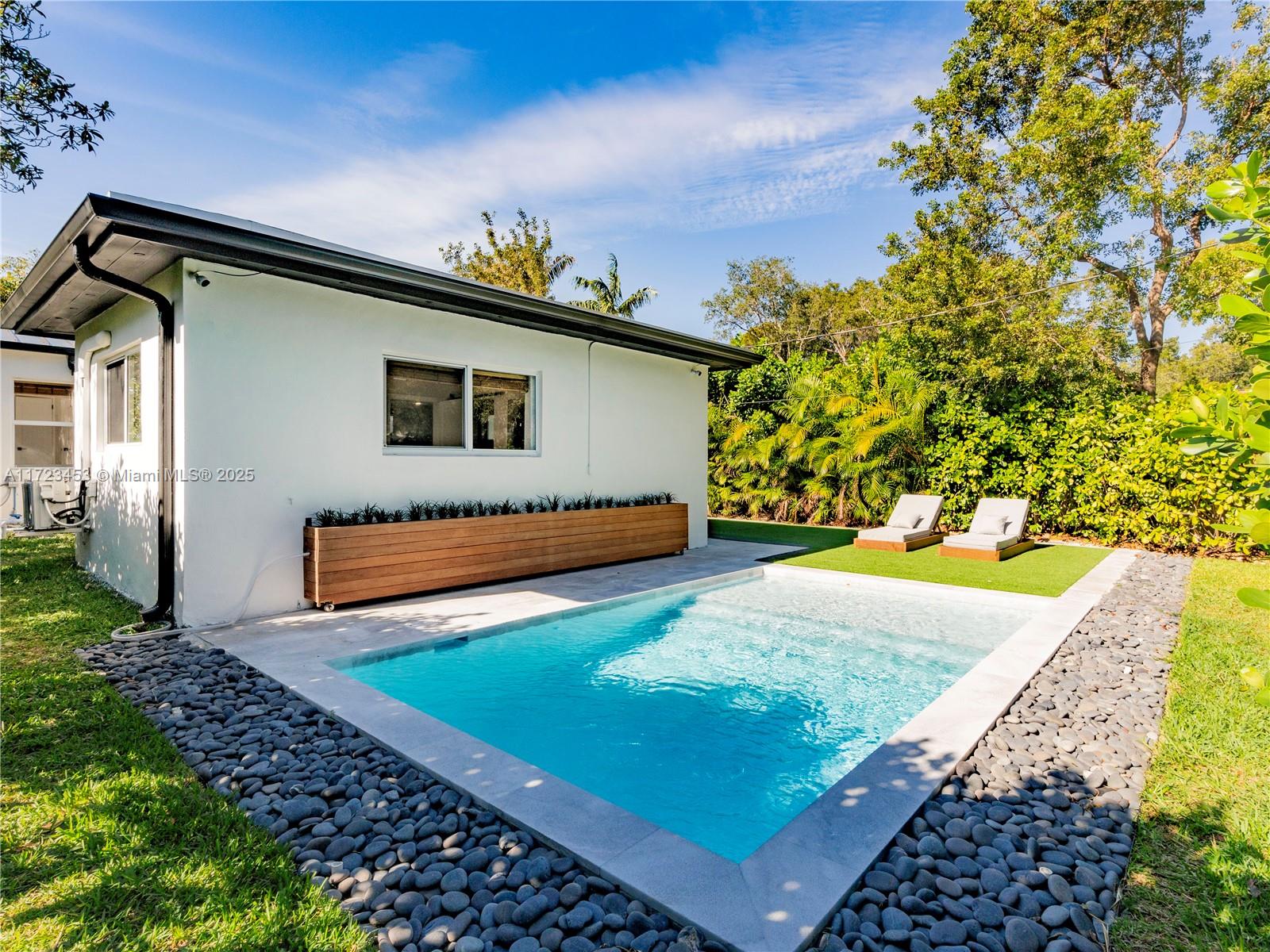 1001 Southwest 23rd Road Miami, FL 33129 - Photo 22 of 38 a view of a house with a yard