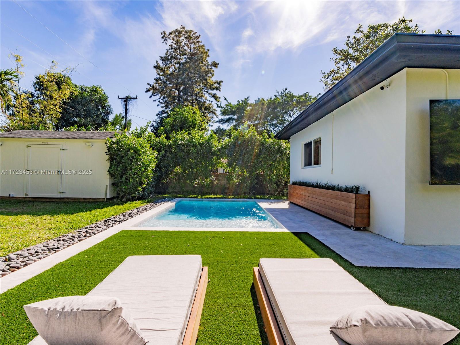 1001 Southwest 23rd Road Miami, FL 33129 - Photo 23 of 38 a view of an house with swimming pool outdoor seating