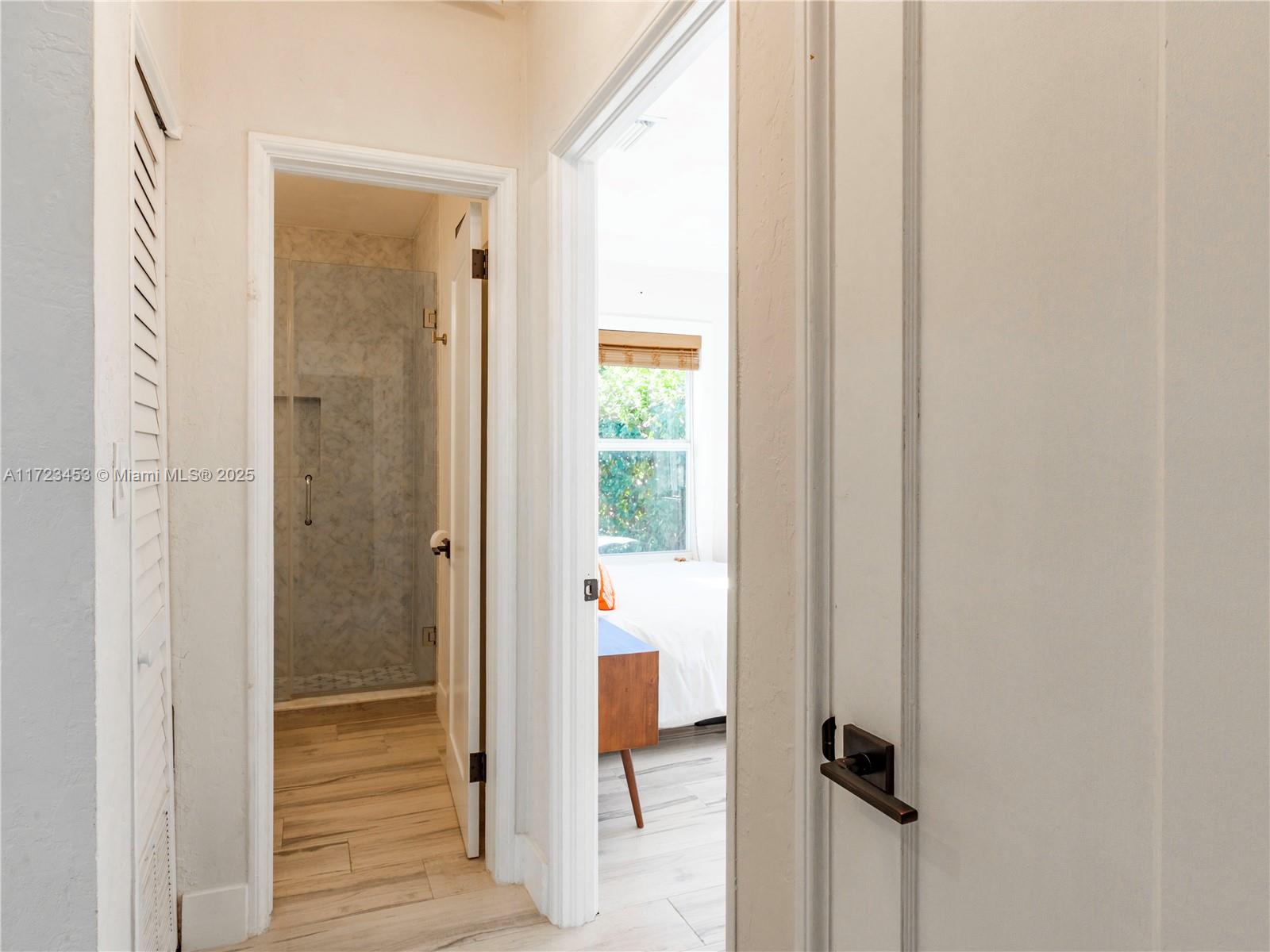 1001 Southwest 23rd Road Miami, FL 33129 - Photo 30 of 38 a view of a hallway with wooden floor and closet area