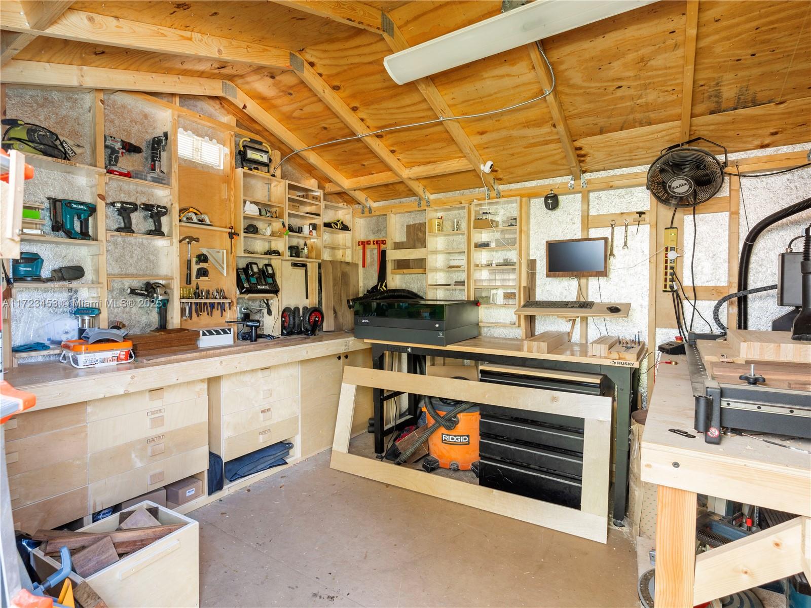 1001 Southwest 23rd Road Miami, FL 33129 - Photo 33 of 38 a kitchen with stainless steel appliances a stove and cabinets