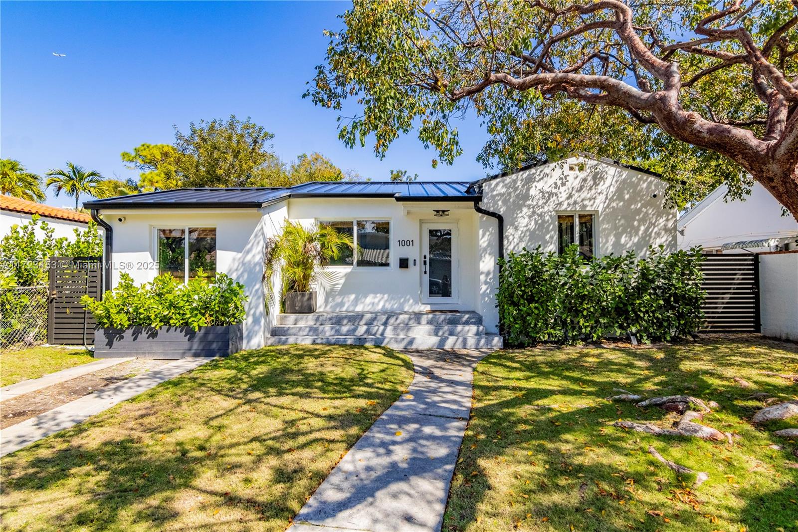 1001 Southwest 23rd Road Miami, FL 33129 - Photo 36 of 38 a view of a house with a patio