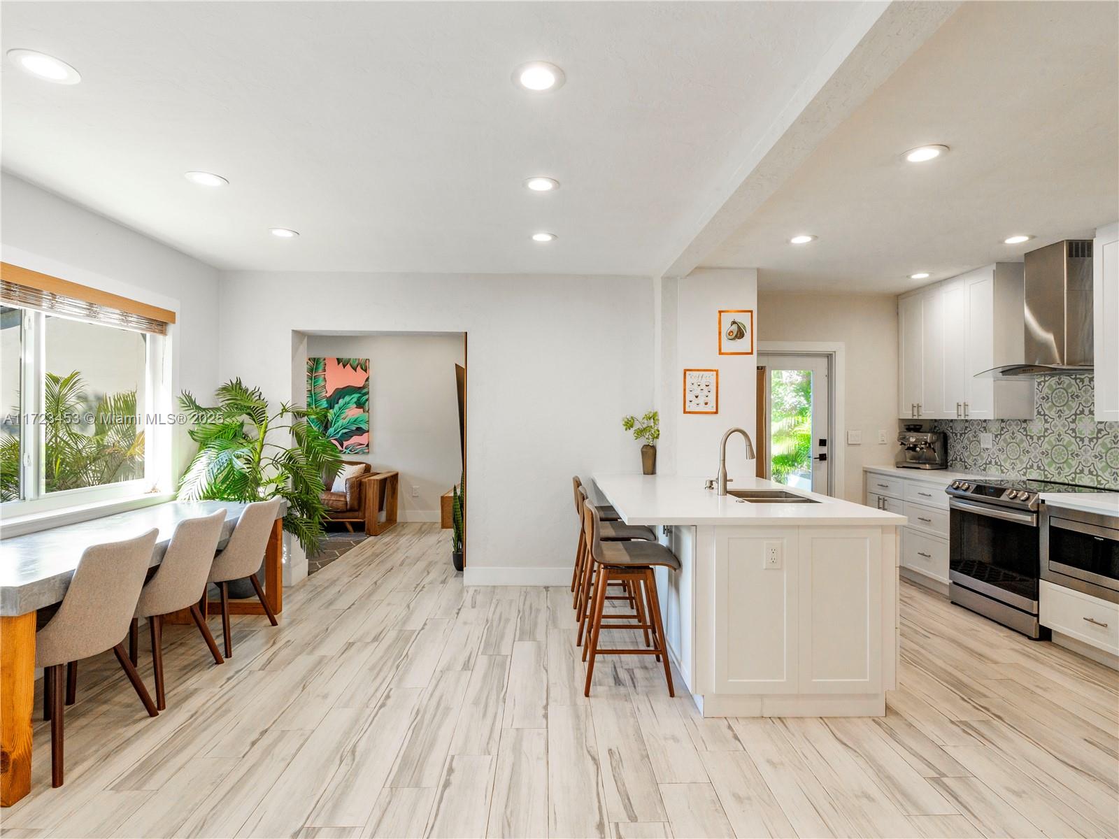 1001 Southwest 23rd Road Miami, FL 33129 - Photo 5 of 38 a living room with furniture and a wooden floor