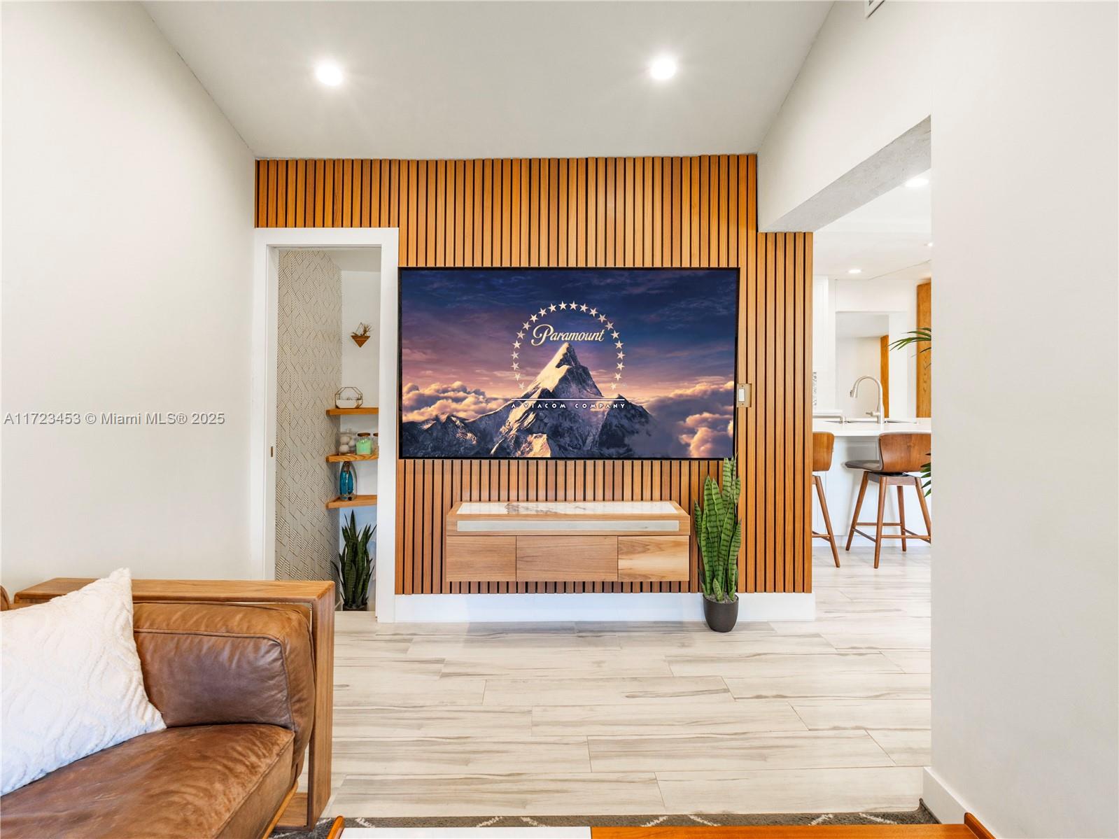 1001 Southwest 23rd Road Miami, FL 33129 - Photo 9 of 38 a living room with a couch and a fireplace