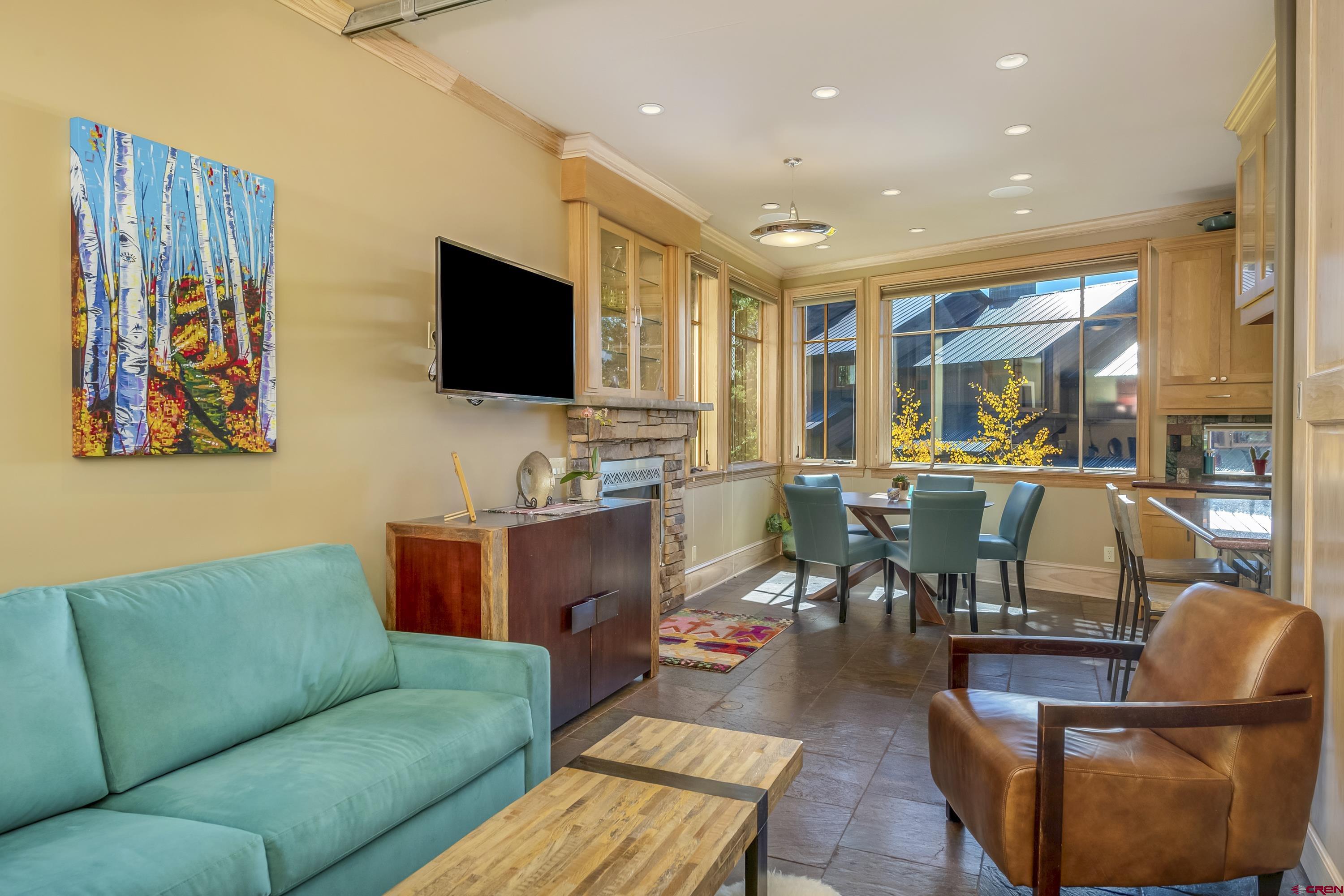 19 Castle Road, Unit 5 Crested Butte, CO 81225 - Photo 12 of 32 a living room with furniture kitchen view and a large window