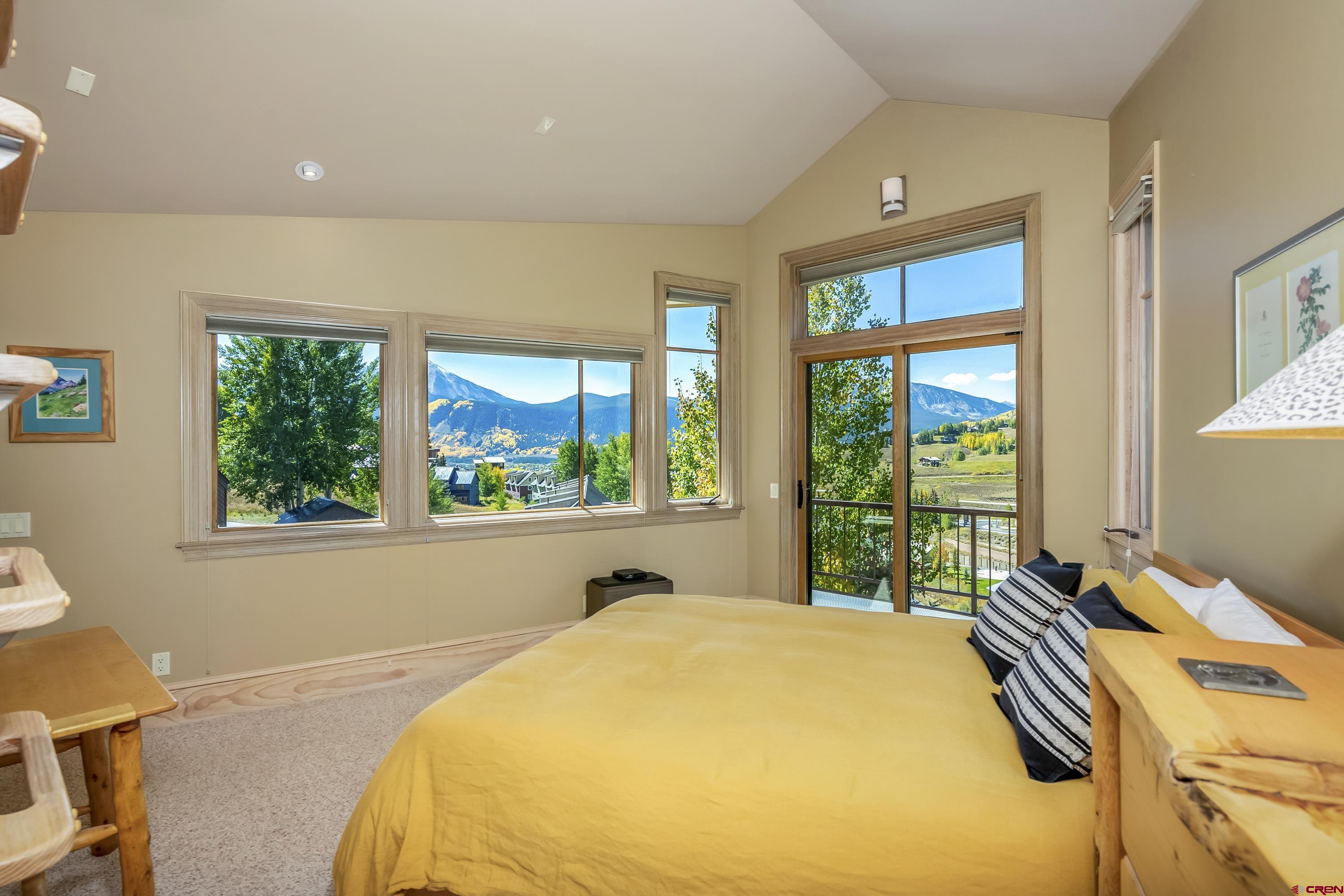 19 Castle Road, Unit 5 Crested Butte, CO 81225 - Photo 16 of 32 a bed sitting in a bedroom next to a window
