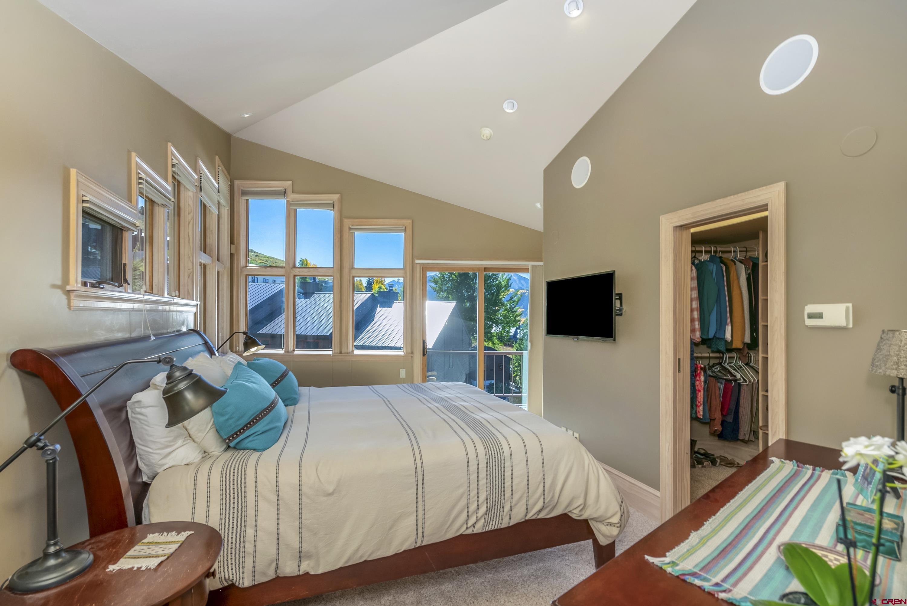 19 Castle Road, Unit 5 Crested Butte, CO 81225 - Photo 20 of 32 a bedroom with a bed and flat screen tv