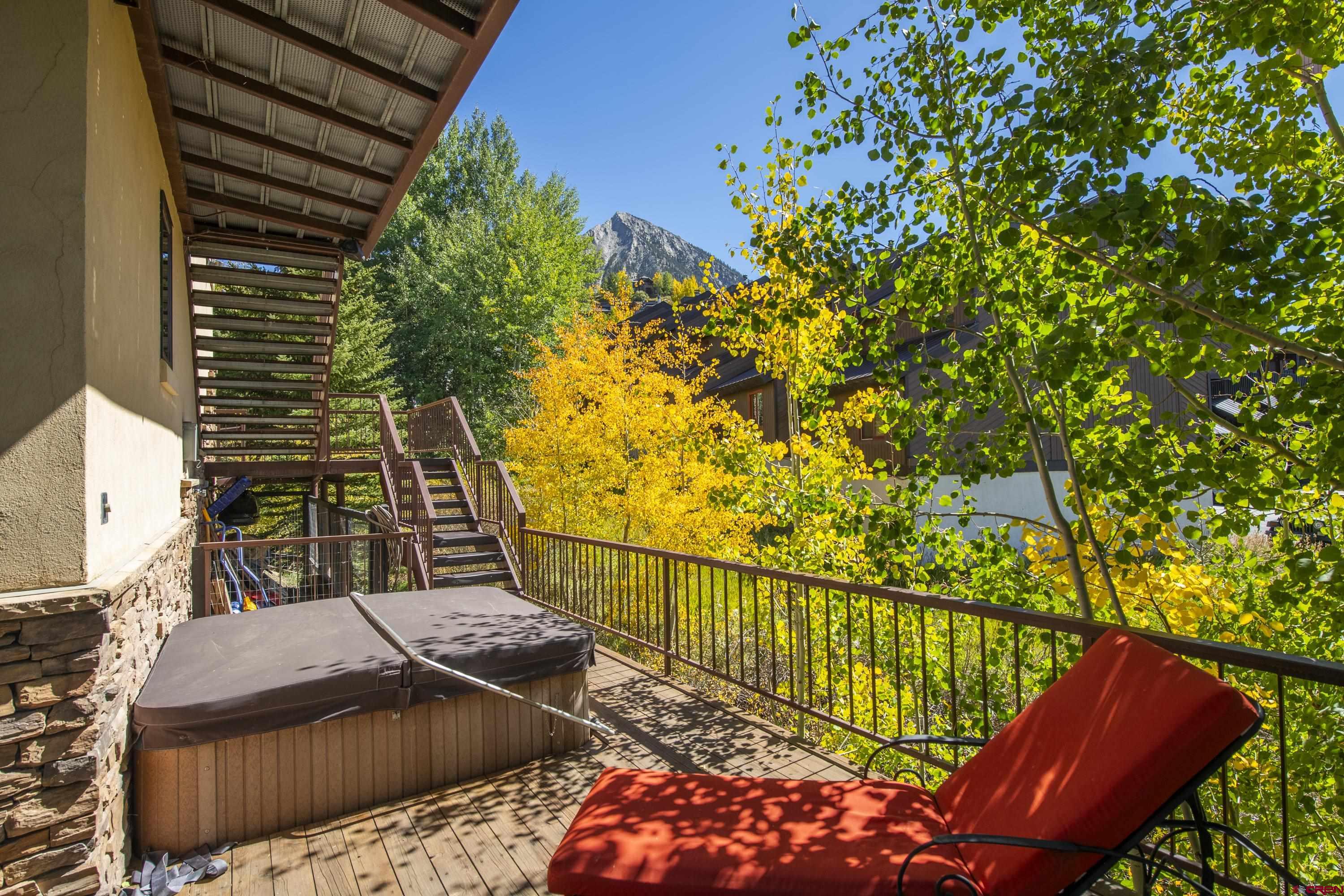 19 Castle Road, Unit 5 Crested Butte, CO 81225 - Photo 26 of 32 a view of balcony with wooden floor and outdoor seating