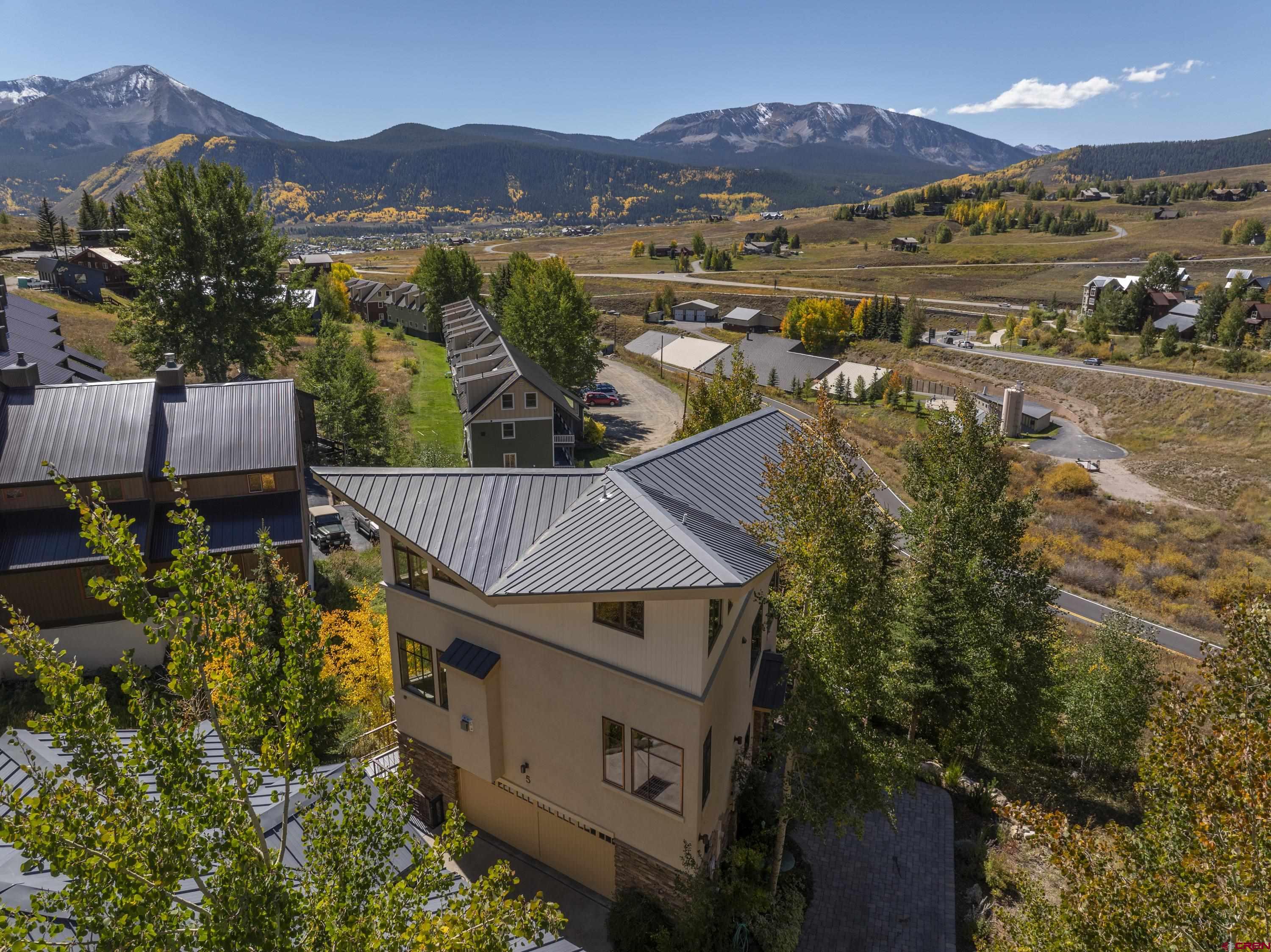 19 Castle Road, Unit 5 Crested Butte, CO 81225 - Photo 30 of 32 an aerial view of residential houses with outdoor space and trees