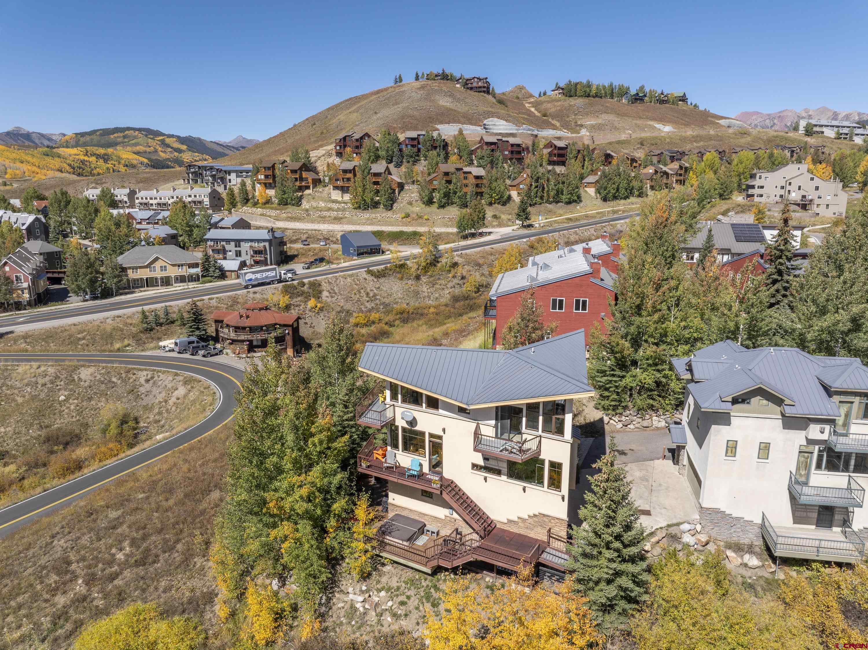 19 Castle Road, Unit 5 Crested Butte, CO 81225 - Photo 31 of 32 an aerial view of residential houses with outdoor space and trees