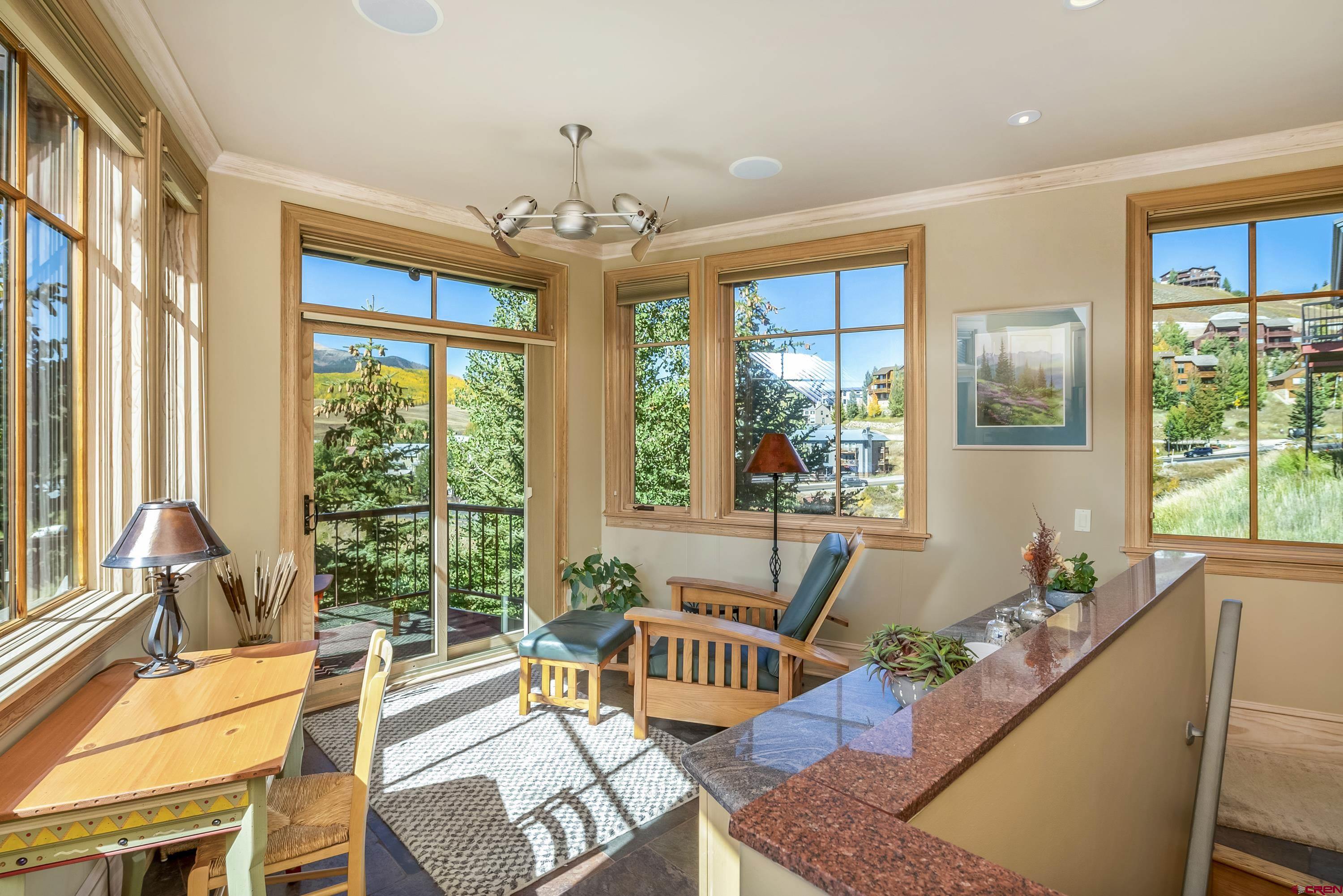 19 Castle Road, Unit 5 Crested Butte, CO 81225 - Photo 6 of 32 a living room with furniture and a chandelier