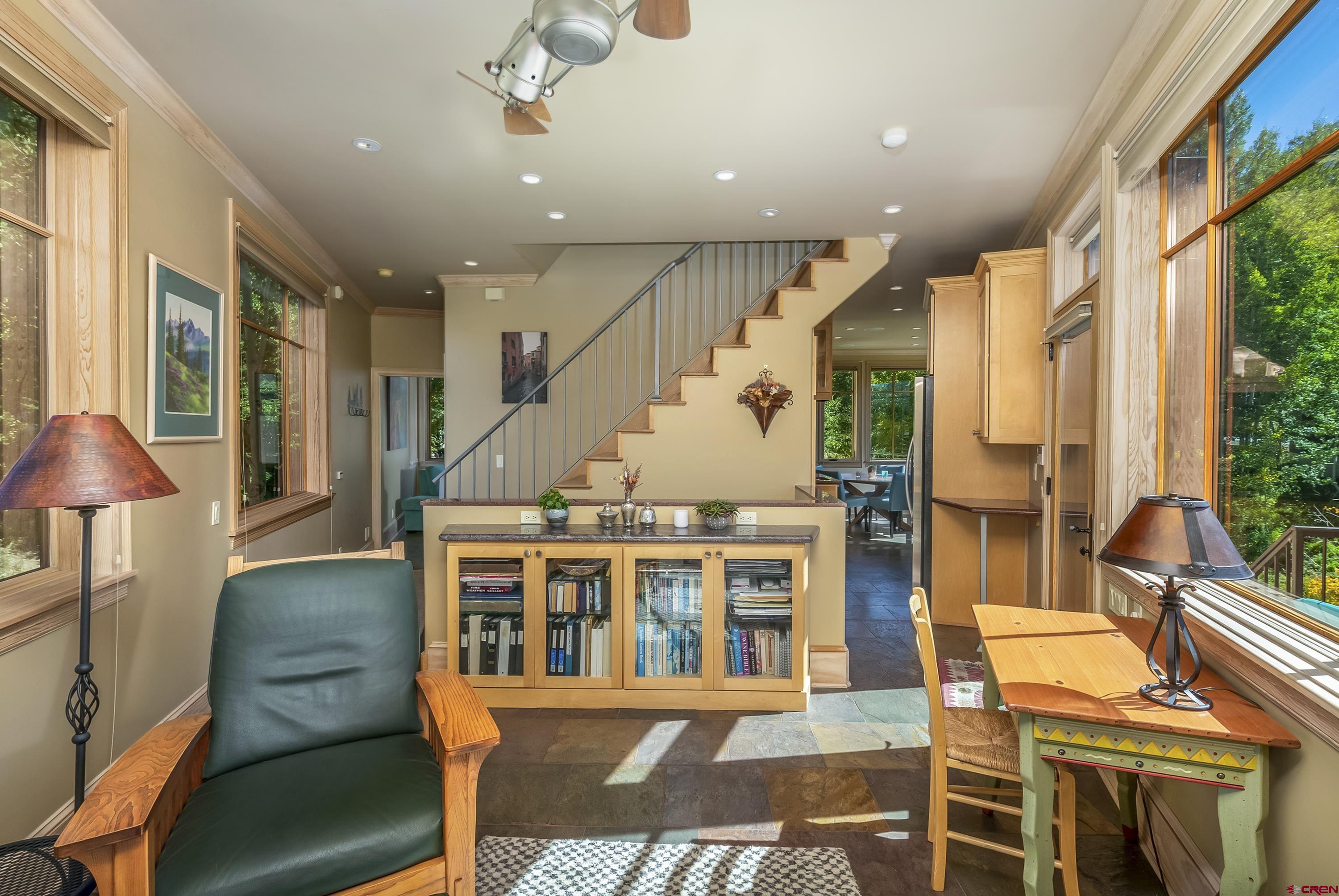 19 Castle Road, Unit 5 Crested Butte, CO 81225 - Photo 7 of 32 a living room with furniture a rug and a chandelier
