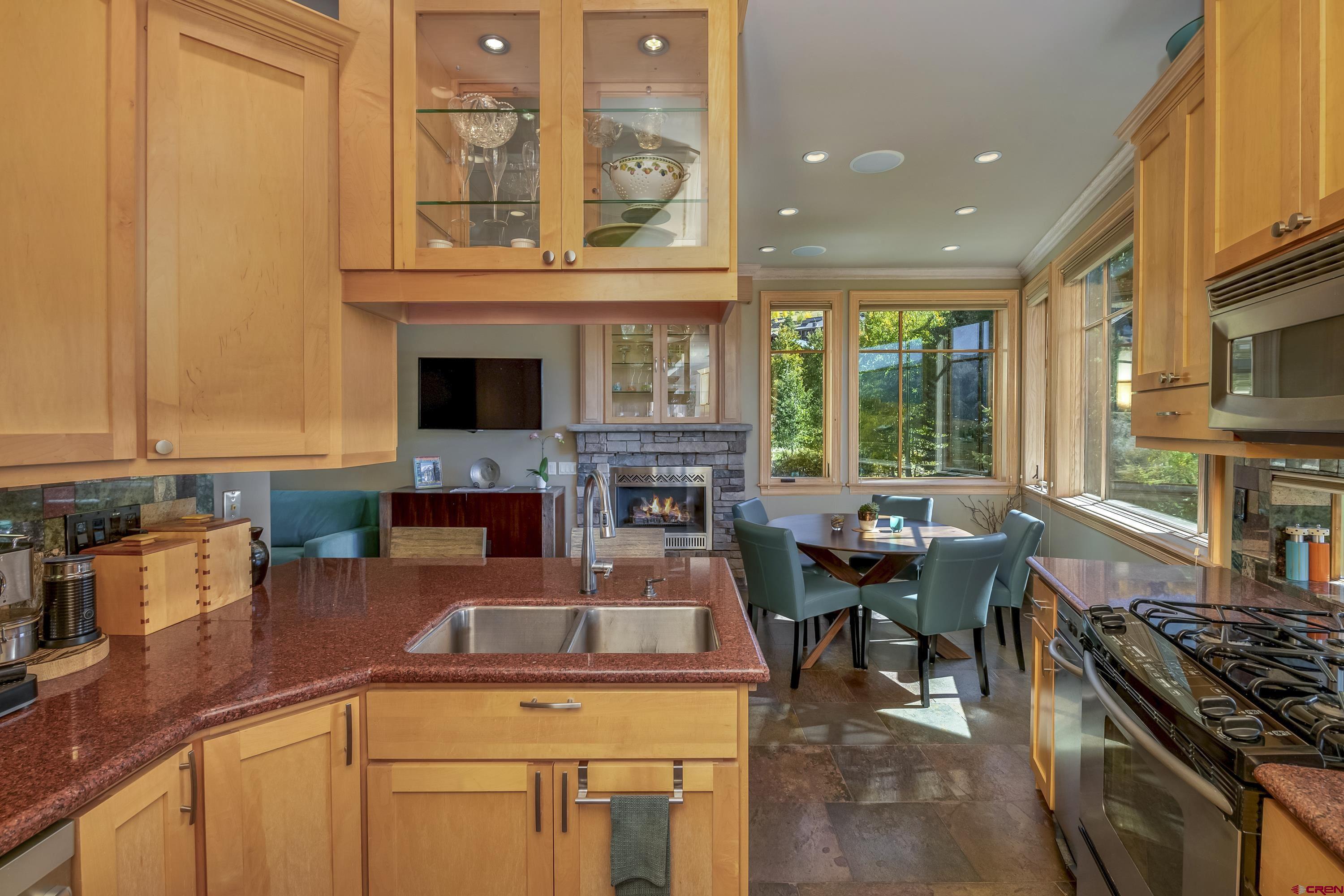 19 Castle Road, Unit 5 Crested Butte, CO 81225 - Photo 8 of 32 a dining hall with stainless steel appliances granite countertop a stove top oven a sink and dishwasher