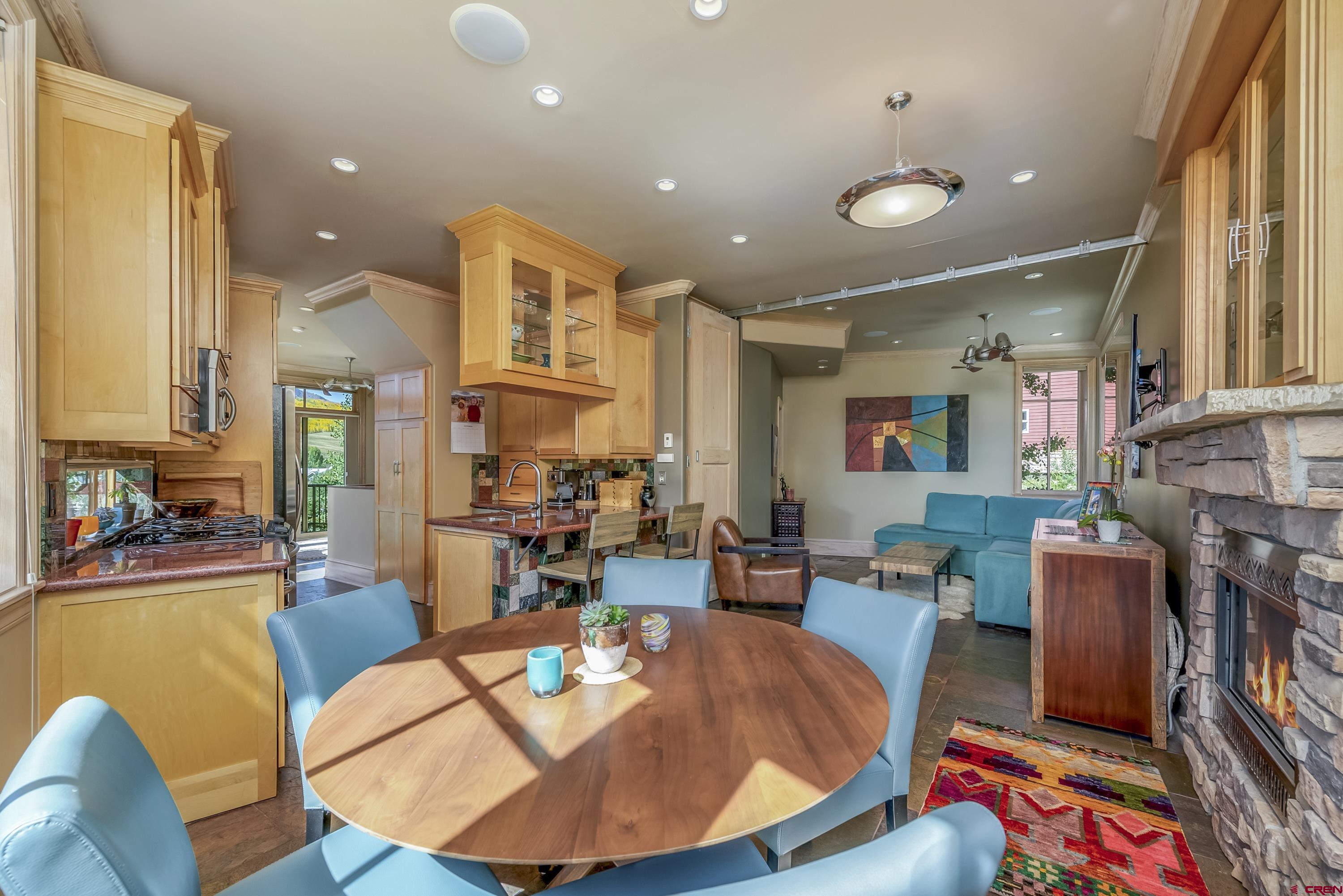 19 Castle Road, Unit 5 Crested Butte, CO 81225 - Photo 10 of 32 a living room with fireplace furniture and a large window