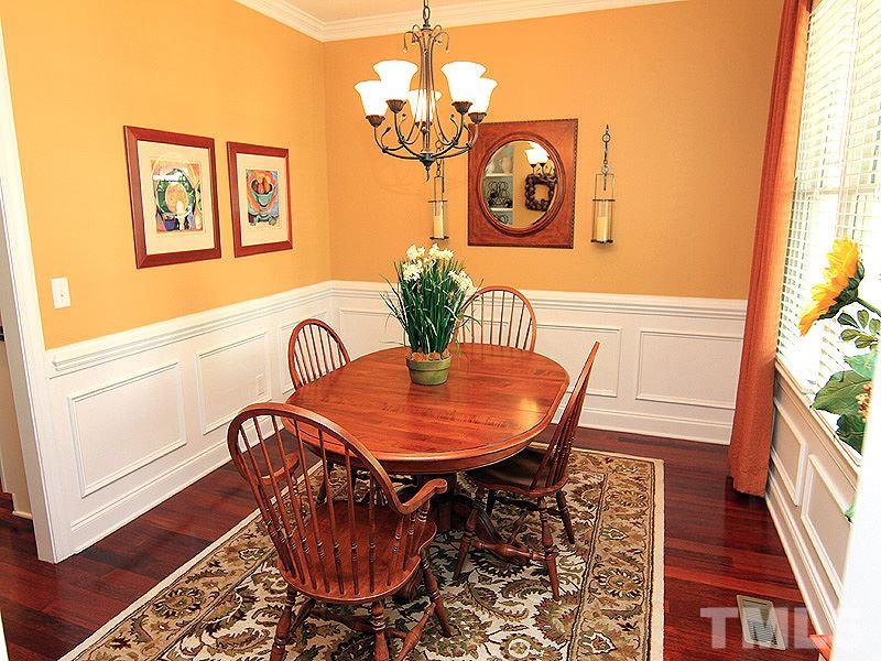 2208 Karns Place Raleigh, NC 27614 - Photo 4 of 25 a view of a dining room with furniture wooden floor and a chandelier