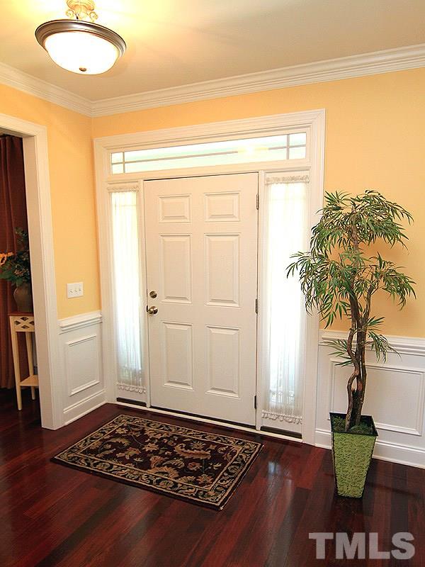 2208 Karns Place Raleigh, NC 27614 - Photo 5 of 25 a view of a livingroom with wooden floor and a plant
