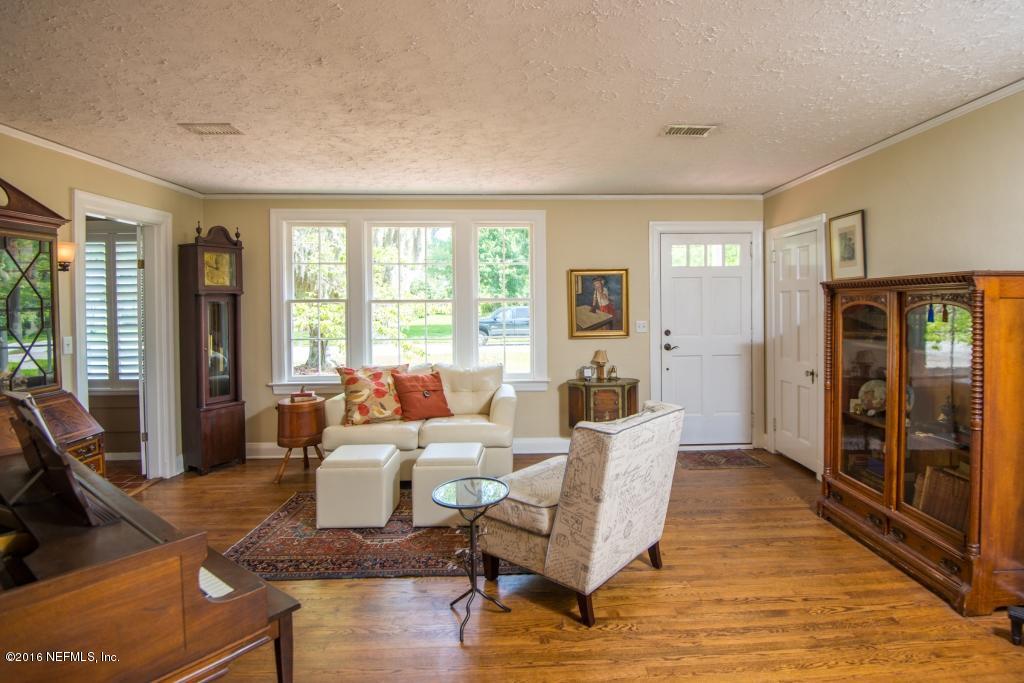 1128 Greenridge Road Jacksonville, FL 32207 - Photo 13 of 37 a living room with furniture and large windows
