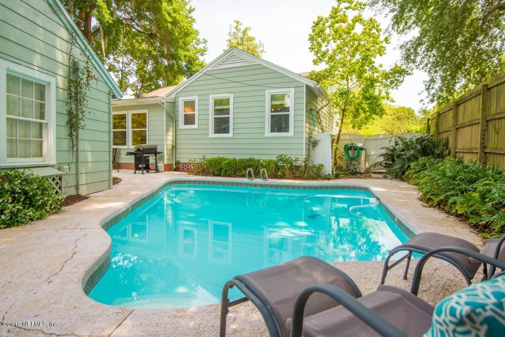 1128 Greenridge Road Jacksonville, FL 32207 - Photo 2 of 37 a backyard of a house with table and chairs