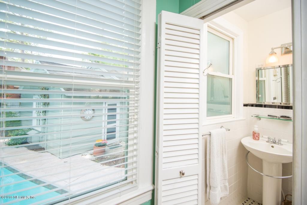 1128 Greenridge Road Jacksonville, FL 32207 - Photo 21 of 37 a bathroom with a bathtub and a shower