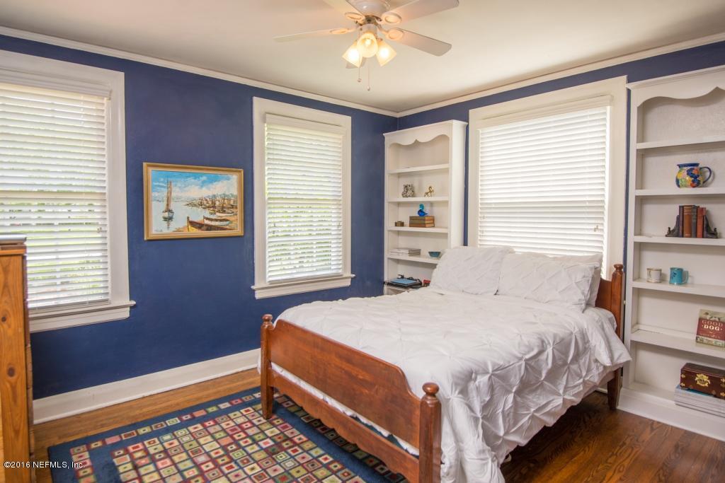 1128 Greenridge Road Jacksonville, FL 32207 - Photo 23 of 37 a bedroom with a bed and a window