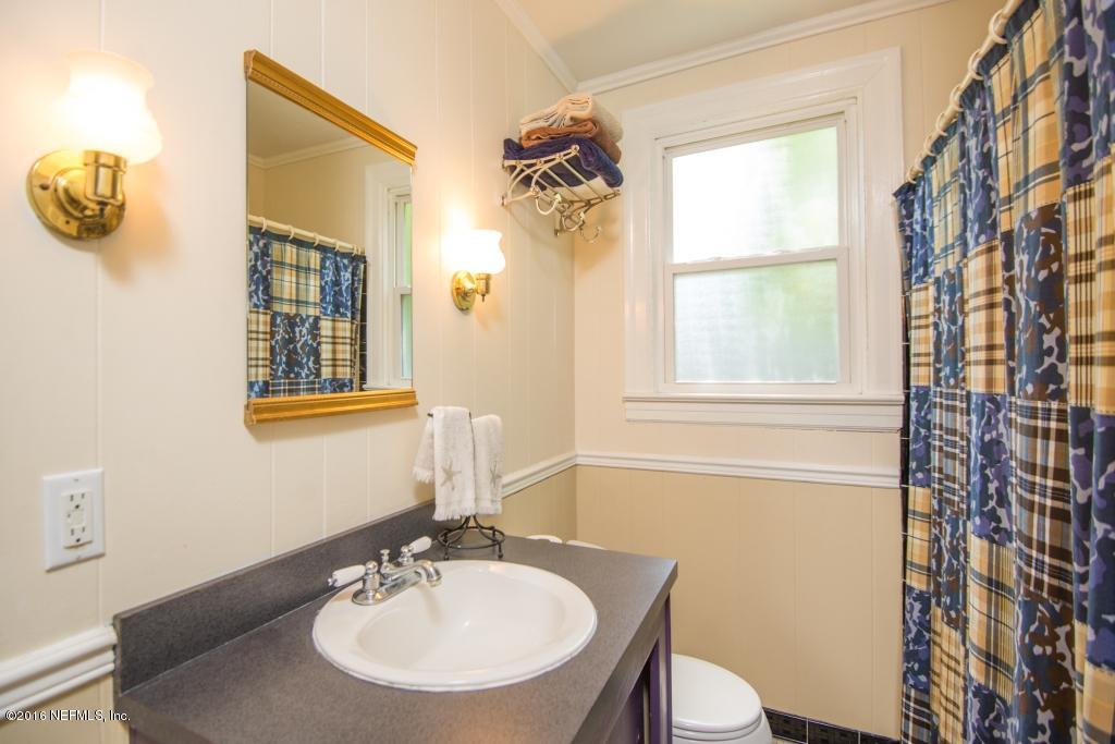 1128 Greenridge Road Jacksonville, FL 32207 - Photo 24 of 37 a bathroom with a sink a mirror and a toilet
