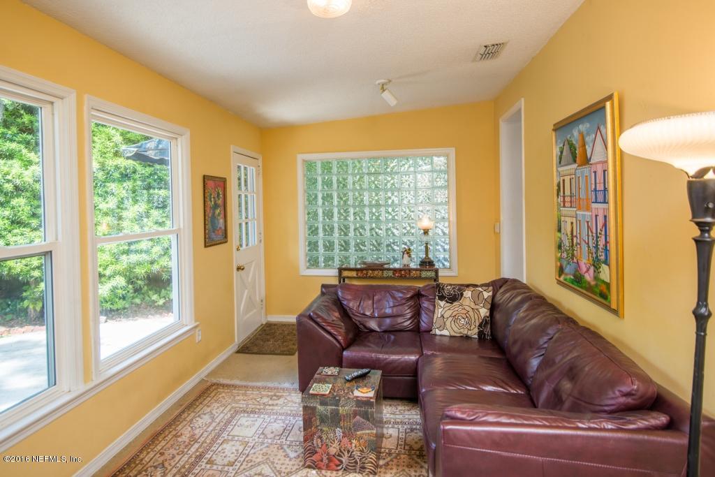 1128 Greenridge Road Jacksonville, FL 32207 - Photo 26 of 37 a living room with furniture and a large window