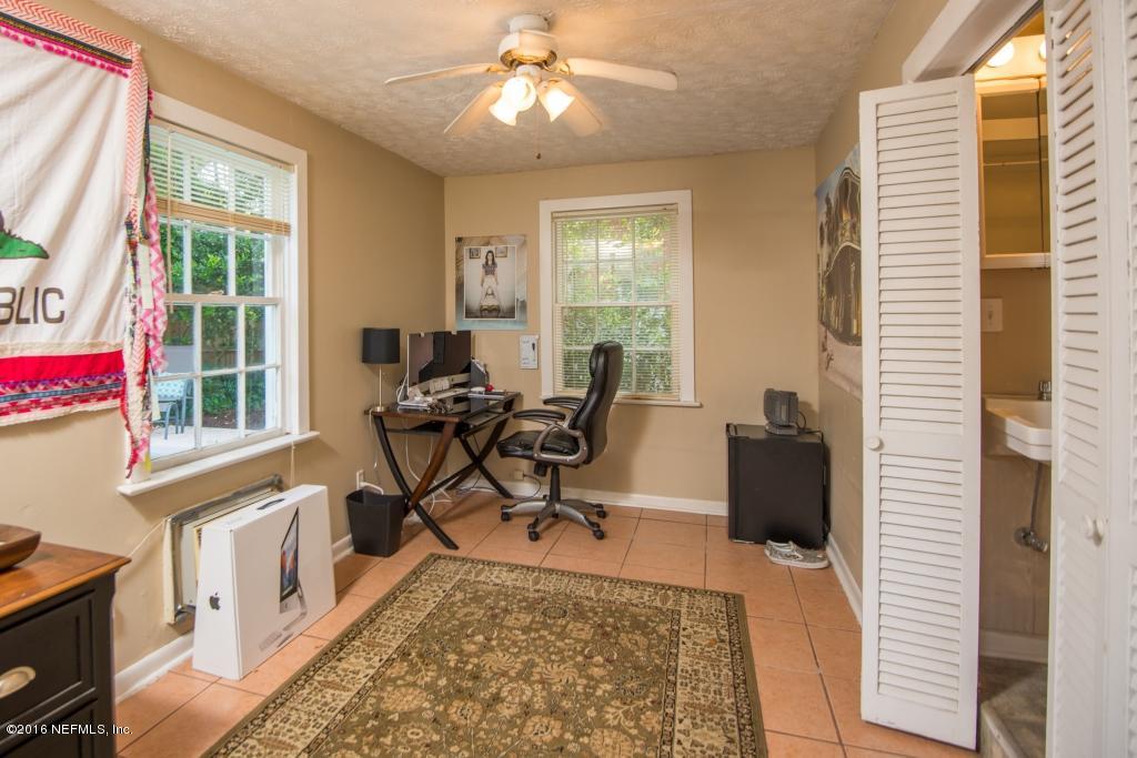 1128 Greenridge Road Jacksonville, FL 32207 - Photo 31 of 37 a view of a workspace with furniture and a window