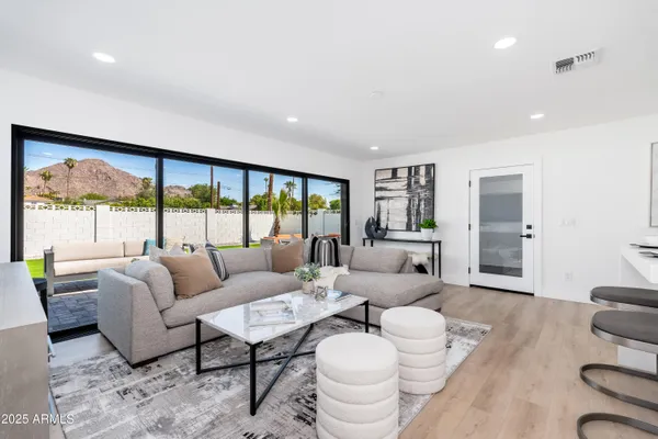 a living room with furniture and a large window