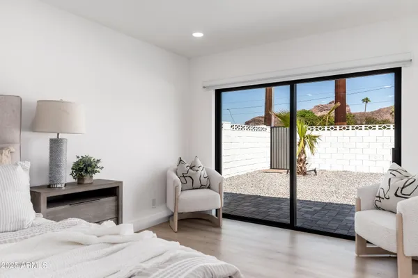 a bedroom with a bed and a couch