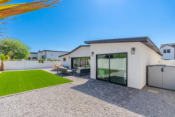 a view of a house with a backyard