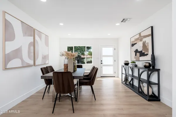 a view of a dining room with furniture and window