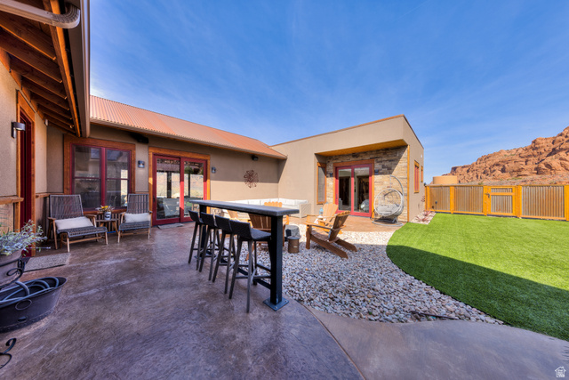 4173 Shadowfax Run, Unit 5 Moab, UT 84532 - Photo 39 of 41 Enclosed courtyard with stained, stamped pathways and rusted metal privacy fence