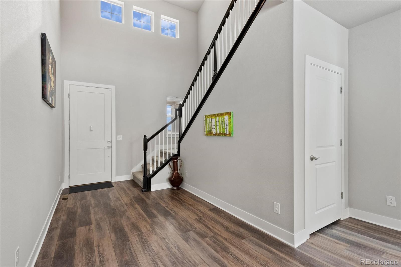 199 Simmental Loop Castle Rock, CO 80104 - Photo 5 of 40 a view of entryway with wooden floor