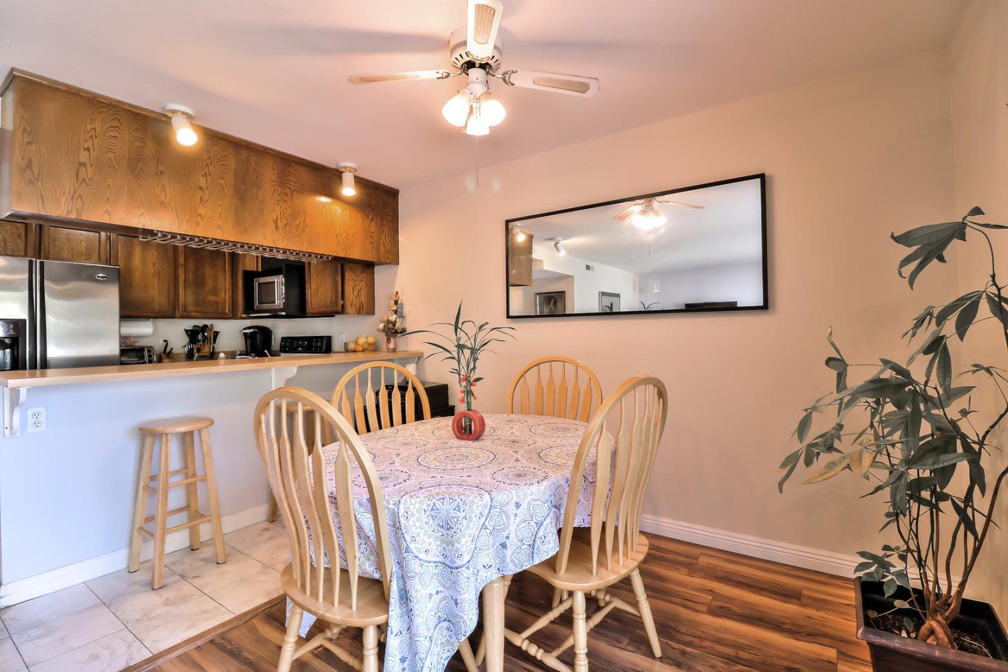 87 Redding Road Campbell, CA 95008 - Photo 2 of 12 a dining room with furniture a window and a flat screen tv