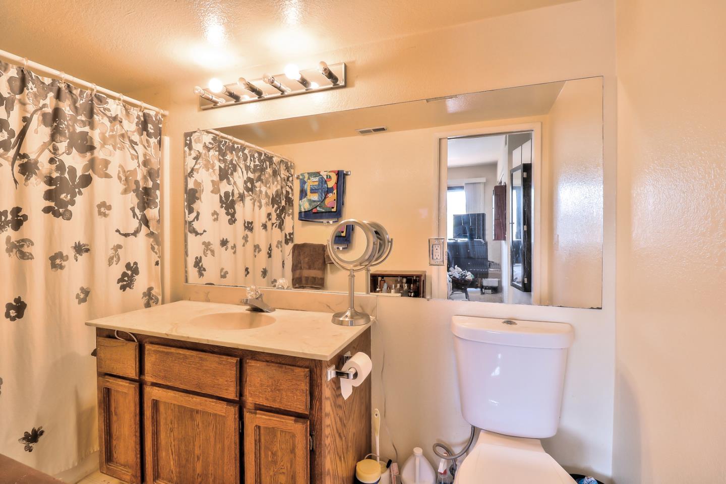 87 Redding Road Campbell, CA 95008 - Photo 5 of 12 a bathroom with a sink toilet vanity and shower