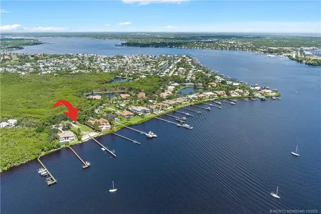 an aerial view of a houses with a lake view