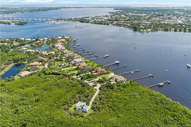 an aerial view of a houses with a lake view