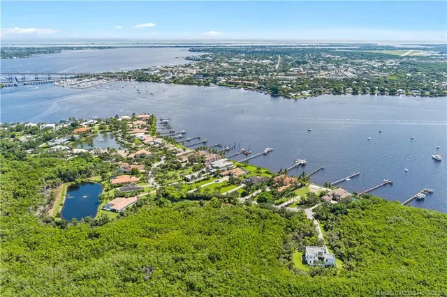 an aerial view of a house with a lake view